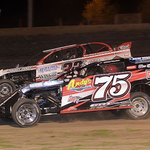 Side-by-side action between Terry Phillips (75) and Zack VanderBeek (33z) during the 9th Annual USMTS Missouri Meltdown at the I-35 Speedway in Winston, Mo., on Saturday, April 22, 2017.